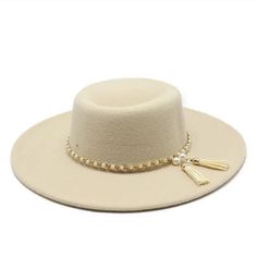 Style: Wide Brim Fedora Hats for Women Item Types: Hats for women, wool fedora hat women's, womens fedora summer hats, womens fedora hat wide brim Gender: Unisex Detail: Imitation pearl tassel band Feature: Fashion accessory, sun protection Material: Cotton Material: Polyester Material: Wool Elegant Solid Color Sun Hat With Flat Brim, Spring Party Fedora Panama Hat, Elegant Brimmed Panama Hat For Winter, Elegant Brimmed Sun Hat For Fall, Elegant Fall Beach Sun Hat, Elegant Beige Winter Fedora, Elegant Solid Color Felt Hat For Spring, Elegant Solid Felt Hat For Spring, Elegant Felt Hat For Spring