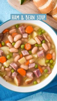 ham and bean soup in a white bowl on a blue towel next to sliced bread