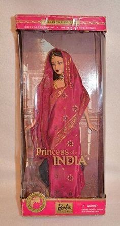 a barbie doll in a pink sari and red shawl with the words princess india written on it