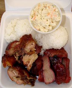 a plastic container filled with meat and rice