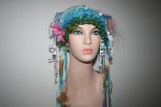 Totally unique! One in the world! Ready To Ship! Soft and fairy-like! Hand Made Freeform knitted forest Mermaid fairy Hat! Unique. One Of A Kind Wearable Art.  Makes a lovely gift! Comes Gift Wrapped! Lovely colours, blue, green, pink, lilac purple and white tones.  You will be the only one in the world to wear this hand made knitted item! Each item that I make is slightly different because it's hand made and colours vary. You will be receiving the actual item in these photos, it's already made Whimsical Crochet Hat For Festivals, Whimsical Handmade Crochet Hat, Whimsical Handmade Crochet Hat For Festival, Whimsical Handmade Crochet Festival Hat, Handmade Whimsical Crochet Hat For Festivals, Whimsical Handmade Multicolor Costume Hats And Headpieces, Bohemian Crochet Mini Hats, Bohemian Yarn Mini Hats, Bohemian Mini Hats In Yarn