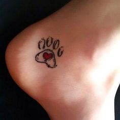 a small tattoo on the back of a woman's left leg that says love