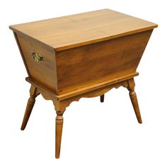 an old wooden chest with two legs and a drawer on one side, the top is turned upside down