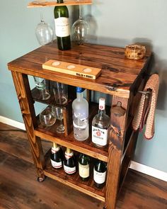 a wooden shelf with bottles and glasses on it