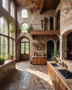 a large kitchen with stone walls and flooring