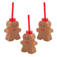 two plastic gingerbreads with red tops and one has a bow tie on it's head