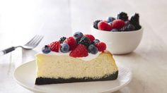 a slice of cheesecake with berries on top