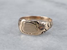 "This small Victorian signet ring features engraved curlicues across the shoulders of the piece. This would make an awesome piece for a small, demure pinky ring, a midi ring, or a gift for a young girl. Traditionally, this ring was given as a gift for a baby, for the baby's birth or baptism, in the Victorian era. Market Square Jewelers works with one of the finest hand engravers in the northeast. With over 30 years of experience, our engraver hand carves lettering, monograms, crests, or patterns Rose Gold Top, Gold Shield, Gold Amethyst Ring, Market Square, Chalcedony Stone, Chalcedony Ring, Personalized Ring, Midi Ring, Antique Roses