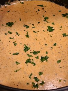 a pot filled with soup sitting on top of a stove