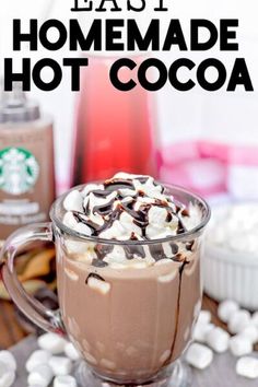 hot chocolate in a glass mug with whipped cream on top