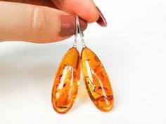 Light orange natural amber earrings/ drop amber earrings for | Etsy Amber Earrings For Gift, Baltic Amber Earrings As A Gift, Cognac Color, Amber Earrings, Natural Amber, Amber Jewelry, Earrings Drop, Light Orange, Eye Catching Colors