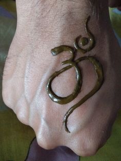 a person's foot with the word om written on it