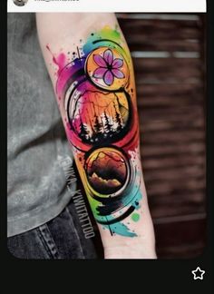 a person with a colorful tattoo on their arm and the image is painted in different colors