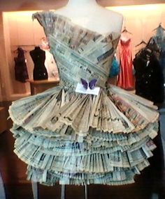 a dress made out of money is on display