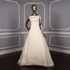 a mannequin dressed in a white wedding dress