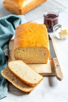 a loaf of bread sitting on top of a cutting board