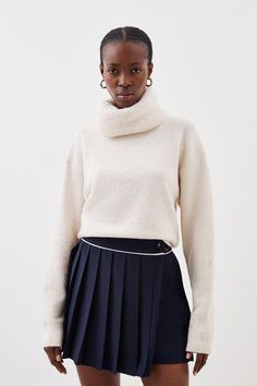 Elevating Classic Silhouettes, This Mini Skirt Is Softly Tailored With Hard Pleats. Featuring A Contrasting Waist Band Detail, And Polished Button Tab Detail For A Smart Touch. Pair With Sumptuous Knit Sweaters And Leather Knee-High Boots For A Trend-Forward Ensemble.Mini Lengthpleated Skirttab Detailcontrast Detail Pleated Skirt Winter Outfit, Pleated Skirt Winter, Pleated Mini Skirt Outfit, Winter Skirt Outfit, Soft Tailoring, Miniskirt Outfits, Knit Sweaters, Knee High Leather Boots, Pleated Mini Skirt