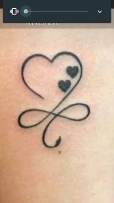 a tattoo with two hearts and an arrow on the back of the arm, in black ink