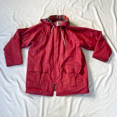 Vintage 1990s red rain jacket. Lined with plaid lining. In good vintage condition. Note: I try to match colors as much as possible to pictures but there is a possibility it won't be an exact match. Unless the color is completely incorrect I am unable to offer refunds for this reason. Size: medium (fits like men's medium, women's large) Brand is Misty Harbor Measurements (taken on garment laid flat): Armpit to armpit: 23.5" Waist: 45" Armpit to hem: 19" Length (top of neck to bottom hem): 30" Fab Red Parka With Pockets For Fall, Red Double-lined Hooded Outerwear For Fall, Red Hooded Raincoat For Winter, Red Hooded Raincoat For Outdoor, Fall Raincoat With Fleece Lining For Rainy Weather, Red Long Sleeve Raincoat For Winter, Red Winter Outerwear For Rainy Weather, Red Winter Raincoat, Red Weatherproof Long Sleeve Outerwear