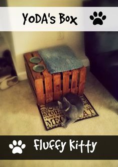 a cat laying on the floor next to a dog crate with its paw in it