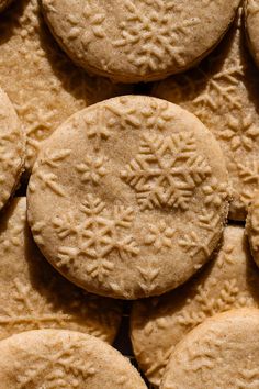 a close up view of some cookies with snowflakes on them