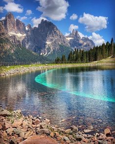 a mountain lake surrounded by rocks and trees