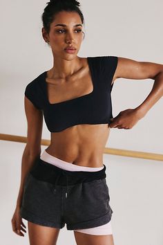 Perfect for low-impact workouts, this bra features a smooth, soft silhouette that contours to your body, and a femme baby tee silhouette with a flattering square neck, cap sleeves, and open back detail. **Fit:** Fitted; baby tee silhouette **Features:** Fitted; Low impact support; smooth, soft fabrication; four-way stretch; breathable; baby tee silhouette; square neck; cap sleeves **Why We | Never Better Baby Tee by FP Movement at Free People, Black, M Sporty Scoop Neck Top With Bra-friendly Design, Supportive Scoop Neck Athleisure Top, Sporty Supportive Scoop Neck Top, Athleisure Tops With Bra Friendly And Minimal Stretch, Bra Friendly Stretch Square Neck Tops, Stretch Square Neck Bra Friendly Tops, Stretch Square Neck Tops Bra Friendly, Fitted Square Neck Top Bra Friendly, Never Better