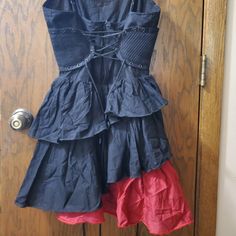 Rare! Black With Red Ruffle. I Can't Find Any Promo Pics Of This, Just The Plain Black Or Red.Cincher Side Panels, Lace Ties Front And Back, Zipper Closure. No Holes, Stains Or Damage. Never Worn. Nwt. M Gothic Cotton Dress With Ruffles, Gothic Red Sleeveless Mini Dress, Red Gothic Dress For Summer, Red Gothic Dress For Spring, Red Gothic Spring Dresses, Fitted Red Gothic Mini Dress, Red Fitted Gothic Mini Dress, Red Gothic Mini Dress For Summer, Gothic Red Summer Mini Dress