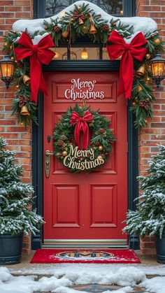 a red door decorated with christmas wreaths and lights