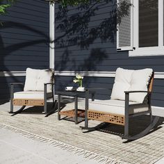 two chairs and a table on a patio