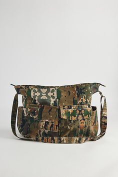 Printed patchwork & camo pattern shoulder bag with utility style pockets. Bag features a main zip compartment and adjustable shoulder strap. Features Camo patch shoulder bag Printed patchwork pattern bag Utility pockets Zip top closure Adjustable strap Content + Care 100% Cotton Spot clean Imported | Camo Patch Shoulder Bag in Assorted, Men's at Urban Outfitters Military Style Bags With Pockets For Everyday Use, Military Style Outdoor Bags With Pockets, Utility Shoulder Bag For Daily Use, Military Style Satchel Bag For Everyday Use, Military Style Everyday Bag With Pockets, Military Style Satchel For Everyday Use, Military Travel Bag With Pockets, Military Style Satchel Shoulder Bag For Everyday Use, Military Style Satchel For Daily Use