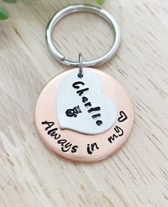 a metal keychain with the words care is always in my heart on it