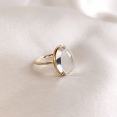 This stunning ring is set in 14k Solid Yellow Gold with Natural Clear Quartz with utmost precision. It is an unique statement gemstone ring for nearly every occasion and is completely hassle-free jewelry. 🔷ABOUT GEMSTONE: Clear quartz, often referred to as the "Master Healer," is a pristine, transparent variety of quartz renowned for its pure energy and versatility. Its crystal clarity represents clarity of mind, and it is believed to amplify the properties of other gemstones. It serves as a po Formal Rings With Si Clarity, Round Shape, 14k Gold Crystal Ring As Gift, Timeless Round Moonstone Ring Gift, Timeless Round Moonstone Ring As Gift, Modern Oval Yellow Gold Moonstone Ring, Timeless 14k Gold Crystal Ring For Gift, Modern Oval Moonstone Ring In Yellow Gold, Modern Yellow Gold Oval Moonstone Ring, Modern White Gold Dome Ring As Gift