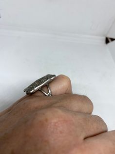 Vintage ring surrounded by Swiss cut fine Marcasite Sterling silver Size 5 Tarnished from age Can be polished. can be sized by my jeweler. His service charge is $10-$20 All rings are shipped in a nice gift box. Check out our over a THOUSAND great reviews Engraving is $4 per letter and is not always perfect depending on the piece. It can take a few days if the jeweler is busy. This is payable to Paypal Judithsltd@gmail.com Antique Silver Open Signet Ring, Silver Antique Signet Ring, Art Deco Silver Signet Ring, Silver Art Deco Signet Ring, Antique Silver Engraved Ring With Gemstone, Vintage Silver Signet Ring With Gemstone, Victorian Silver Signet Ring For Gift, Silver Emerald-cut Rings For Collectibles, Silver Emerald Cut Rings Sterling Silver