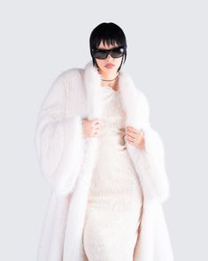 Give off major HBIC vibes in this two-piece set featuring an ivory lace halter mini dress, paired with a midi vegan fur coat 🤍 The perfect blend of classy, and baddie energy - this fit will have everyone bowing down to you 😏 Chic Faux Fur Coat For Party, Chic Fluffy Fur Coat For Party, Chic Fluffy Fur Coat For Spring, Chic Fluffy Fur Coat, Elegant Faux Fur Outerwear For Night Out, Elegant Winter White Fur Coat With Faux Fur Lining, Elegant Winter White Faux Fur Coat, Glamorous Fitted Faux Fur Coat, Glamorous White Evening Outerwear