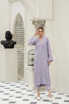 Introducing our stunning Lavender chiffon embroidered shirt hand-worked and embellished with minute mirror work details. Paired with matching raw-silk pants. This elegant dress is adorned with intricate details, featuring beautiful embroidery and embellishments. Elegant Sequined Kurta, Elegant Purple Palazzo Set With Resham Embroidery, Elegant Georgette Kurta With Sequins, Elegant Sequined Kurta For Eid, Elegant Sequined Palazzo Set In Georgette, Elegant Georgette Lawn Suit With Mirror Work, Elegant Purple Lawn Suit With Intricate Embroidery, Elegant Sequined Palazzo Set With Straight Kurta, Elegant Sequined Straight Kurta Palazzo Set