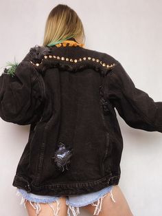 Upcycled black denim jacket with handmade rips. This classic, vintage black denim trucker jacket was decorated with round gold studs and rips. Additionally, there are two types and colors of fringes - black and gold. There is only one piece of such jacket and this makes it one of a kind and eye-catching. If you want to stand out, this jacket is perfect for you. Also, you will rock in it on special events like music festivals or concerts; even photoshoots! Durable 100% cotton denim assures you th Festival Long Sleeve Outerwear With Frayed Hem, Trendy Denim Jacket For Fall Alternative Fashion, Festival Denim Jacket With Frayed Hem, Frayed Hem Denim Jacket For Festivals, Fall Festival Denim Jacket With Fringe, Long Sleeve Denim Jacket With Frayed Hem For Festival, Fall Festival Fringe Denim Jacket, Fringe Denim Jacket For Fall Festival, Edgy Denim Jacket For Fall Alternative Fashion