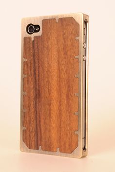 an iphone case made out of wood with metal hardware on the front and back sides