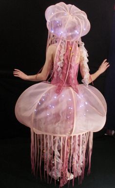 a mannequin dressed as a jellyfish with lights on it's head