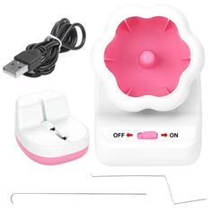 a pink and white device with power cord plugged into the charger next to it