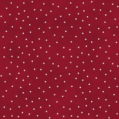 a red background with white polka dots