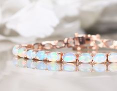 Rose Gold Oval Bracelets For Wedding, Rose Gold Gemstone Bracelets For Wedding, Rose Gold Gemstone Bracelet For Wedding, Adjustable Opal Bracelet Gift, Dainty Adjustable Opal Bracelet, Elegant Luxury Opal Bracelets, Adjustable Beaded Opal Bracelet, White Opal Bracelet, Gold Armband