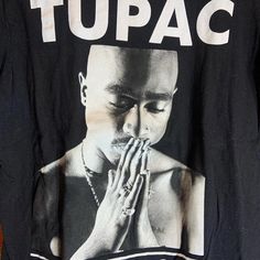 Band: Tupac  Size:  16" pit to pit  &      22" collar to bottom  Colors: black  Condition: excellent  Date : 8/15/24 **all of our shirts are PRE-OWNED and may contain normal wear, fading, stains or imperfections, holes, tears, loose or missing threads. We will do our best to point out significant issues. Thank you for looking!! #tshirt #fashion #clothing #streetwear #shirt Y2k Style Black Pre-shrunk T-shirt, Black Y2k T-shirt With Screen Print, Y2k Black Pre-shrunk T-shirt, Y2k Black T-shirt With Logo Print, Black Y2k T-shirt With Logo Print, Tupac Shirts, Tupac Sweatshirt, California Love Tupac Shirt, 2pac Graphic Tee