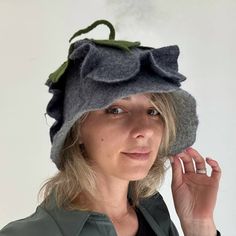 Indulge in the ultimate sauna experience with our exquisite Gray Women's Sauna Hat, handcrafted from the finest Merino Wool. This unique accessory is not only a stylish addition to your wellness routine but also provides practical benefits, keeping your hair dry and protected from the heat. 🧵 Material: Finest Merino Wool 🌟 Style: Charming flower detail for elegance 🎩 Design: Pixie-style, elf-like cap 🛁 Versatility: Ideal for saunas, steam rooms, or winter wear 🎁 Perfect Gift: For those valuing comfort and fashion DETAILS: *Hand wash only in cold water.   Please, note that due to lighting effects, monitor brightness, contrast, and other settings, there might be some slight differences in the color tone/shade of the website's photo and the actual item. Wool Elf Hats, Steaming Felt Hats, Felted Elf Hat, Sauna Hat, Hat Flower, Pixie Hat, Hair Dry, Pixie Styles, Elf Hat