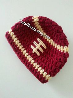 a crocheted hat with a football on it