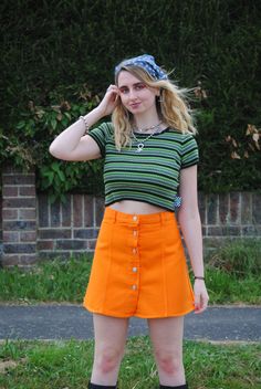 ♥Super cute 90s vintage bright orange denim mini skirt with button up closure! ♥Brand: Miss Cool ♥In brand new deadstock vintage condition (even has the original tags!) ♥Available in UK size 10 and 12. (Labels say size 12 and 14 but as they are vintage the sizing comes up a size smaller, please refer to measurements below). ♥Size 10 - Waist measurement: 28 inches, Hip measurement: 36 inches, Length measurement: 16.5 inches ♥Size 12 - Waist measurement: 31 inches, Hip measurement: 38 inches, Leng Orange Casual Mini Skort, Retro Cotton Skort, Casual Orange Mini Skort, Orange Retro Mini Skirt, Fitted Orange Mini Skort, Orange Cotton Mini Skirt, Orange Fitted Retro Mini Skirt, Orange Cotton Mini Skirt For Spring, Fitted Retro Orange Mini Skirt