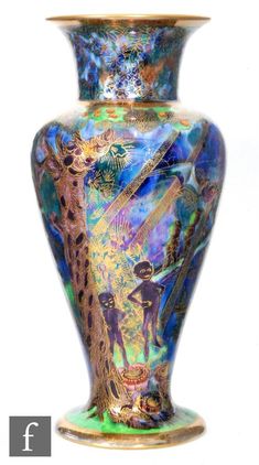 a colorful vase with an artistic design on it's bottom and sides, in front of a white background