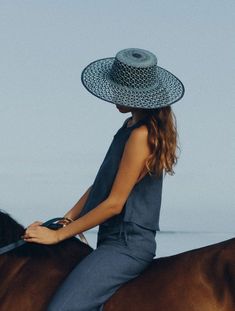 Carlota Straw Hat in Baby Blue + Navy Blue from Van Palma 100% Toquilla adjourned Straw Hat 12 cm width Handwoven in Ecuador Made in France 🇫🇷 56-S / 57-M / 58-L Since 2014, French brand Van Palma has been breathing new life into the accessories aisle with its elegant year-round hat collections. At the helm of this sunny, California-inspired label is Victoria Sanguinetti, a young designer from Marseille who decided to follow her passion rather than her business degree. Navy Hat For Spring, Navy Beach Hat, Chic Blue Straw Hat For The Beach, Navy Brimmed Sun Hat For Summer, Navy Wide Brim Sun Hat For Summer, Navy Beach Hats For Spring, Navy Beach Hat For Spring, Navy Summer Sun Hat For Vacation, Navy Beach Hat For Summer