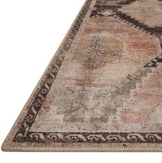 an old rug with faded colors and patterns on the bottom, is shown in front of a white background