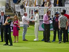 two men shaking hands at the end of a game